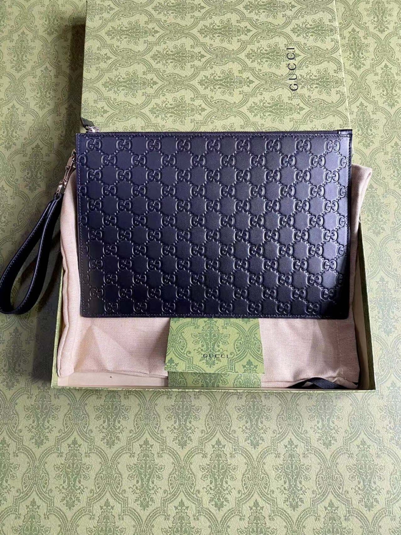 G*u*i clutch bags